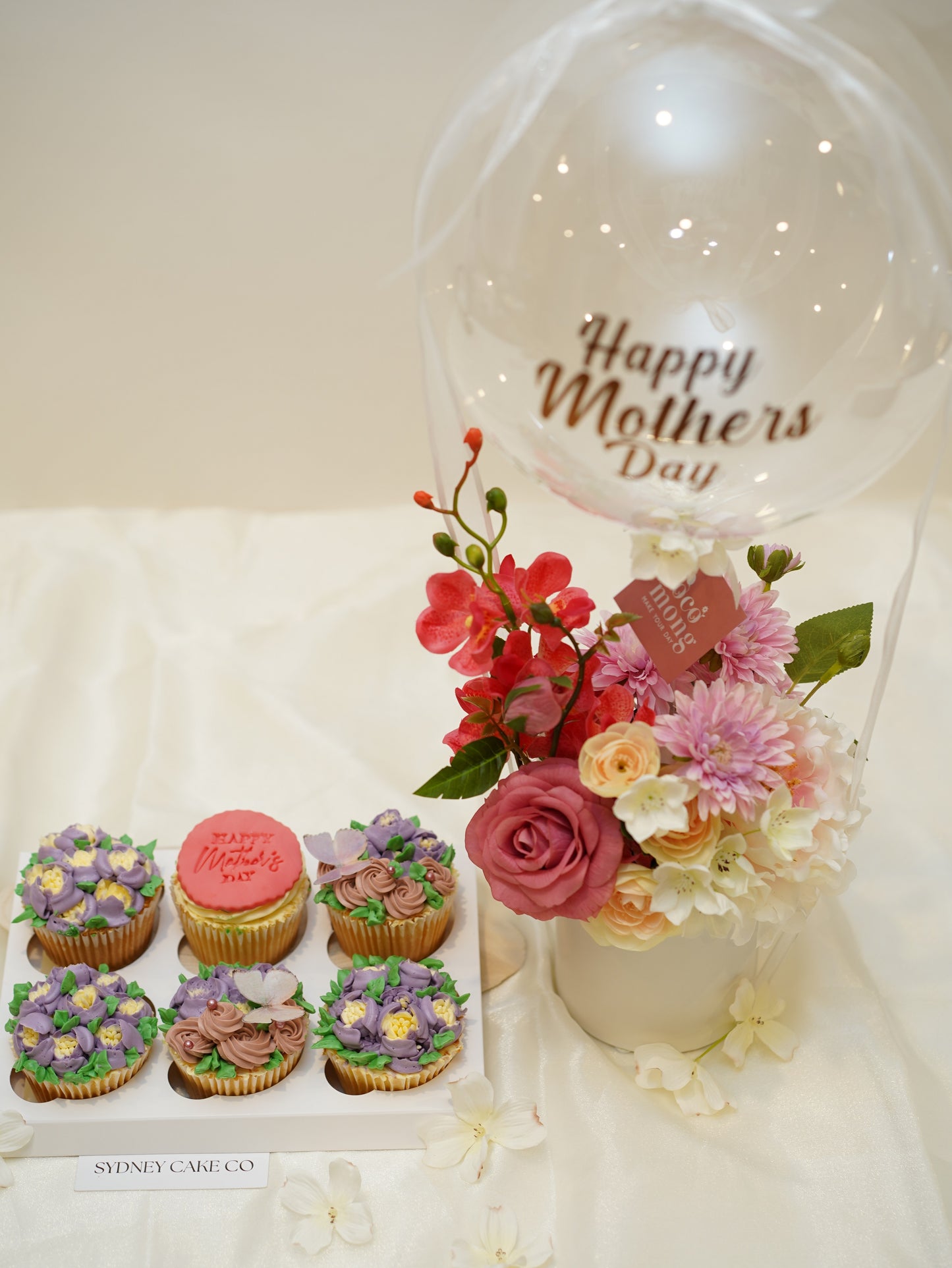 Custom cupcakes with flowers and balloon $159